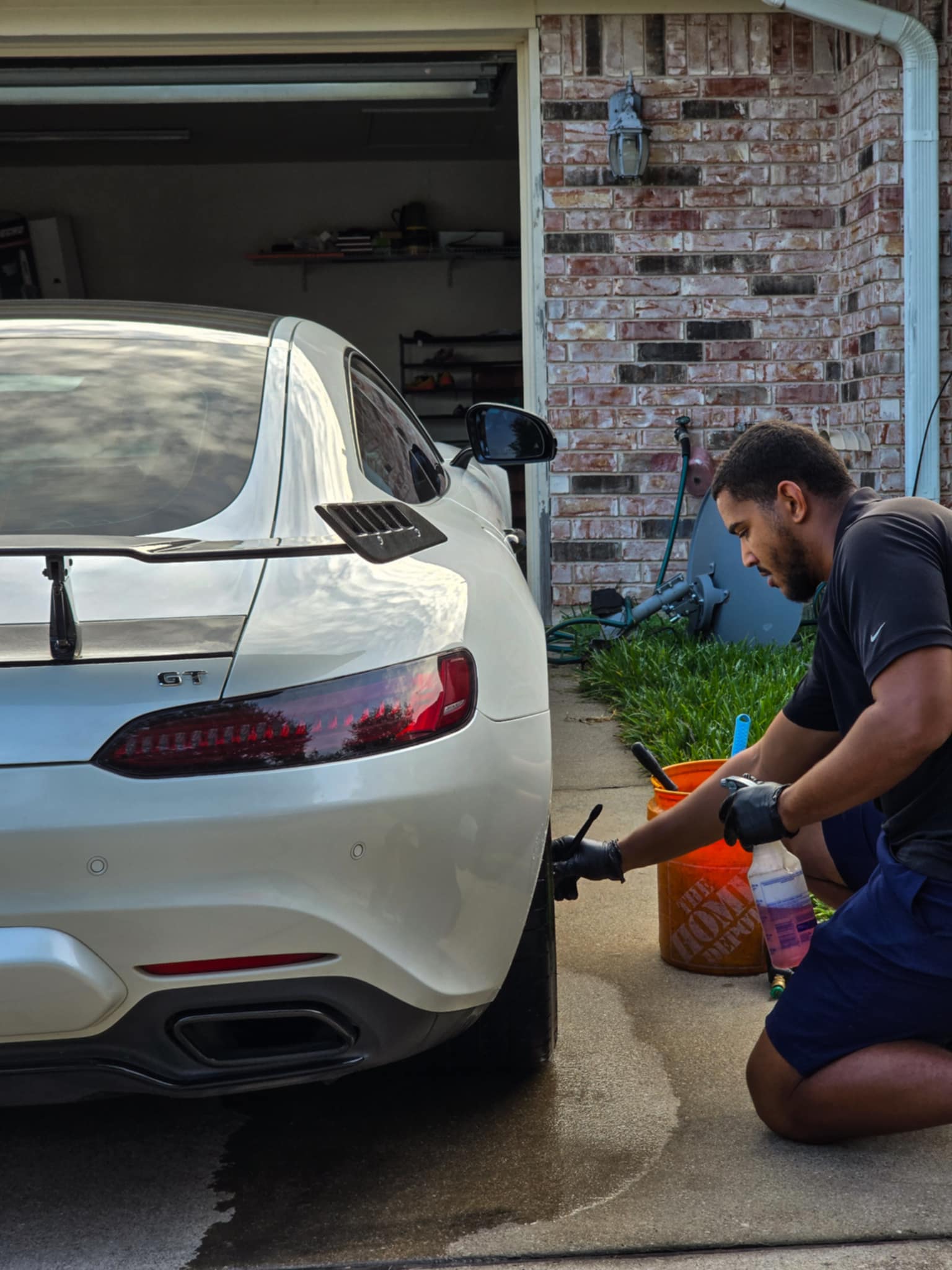 Technician at SkyRides Auto Care applying ceramic coating to a Rivian in Killeen, TX.